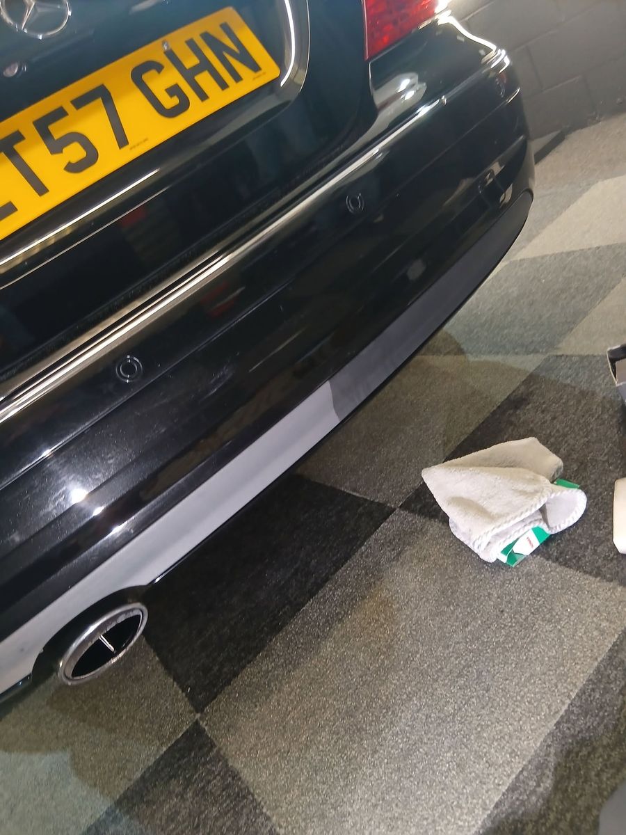 Mercedes rear bumper trim, half faded and half restored