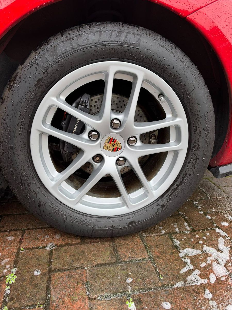 Porsche alloy wheel after cleaning, bright silver